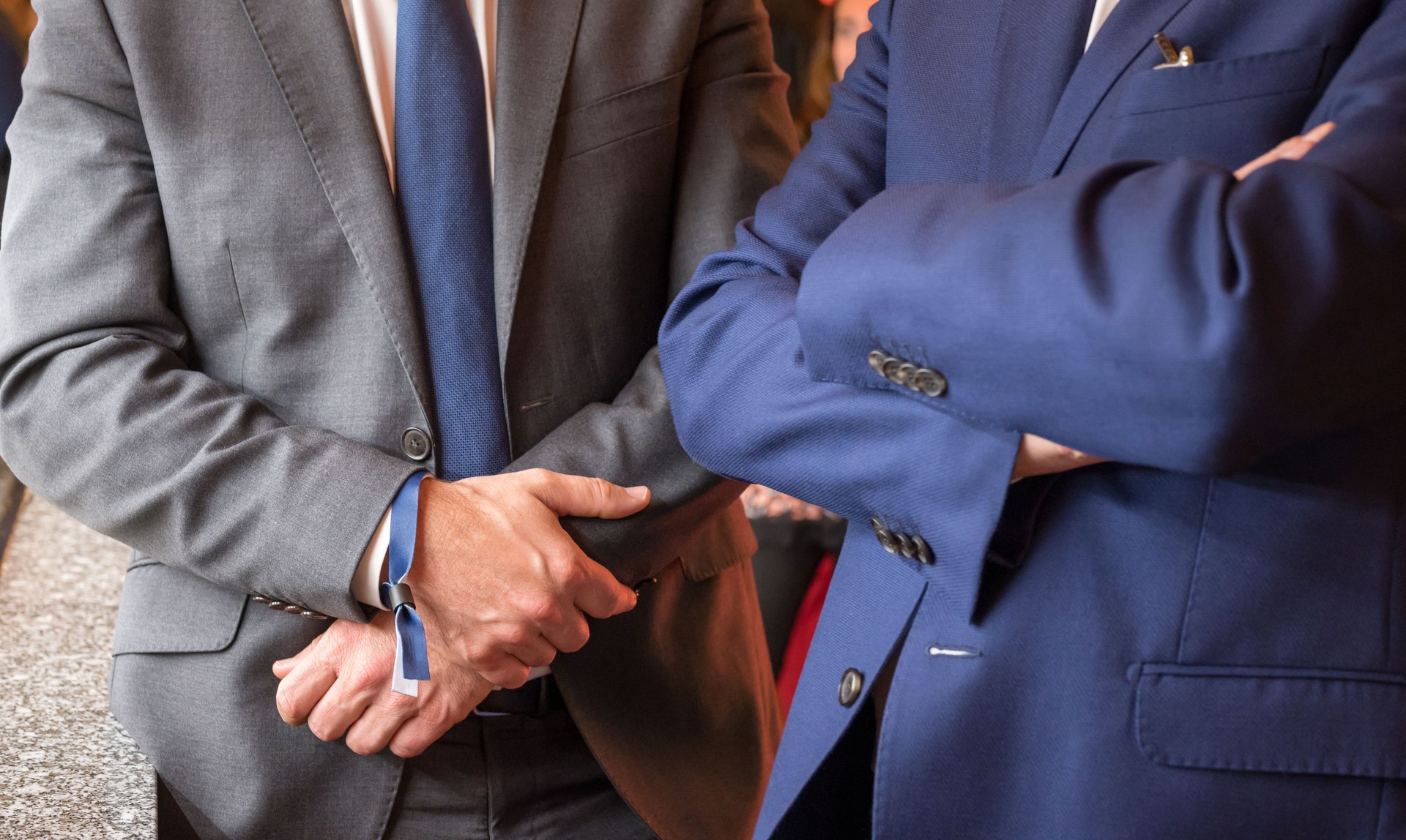 Businessmen with crossed arms